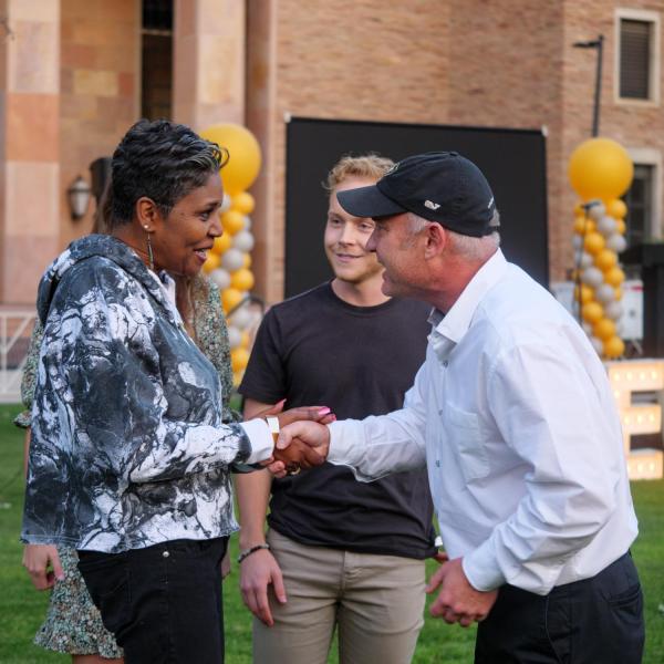 Keynote speakers Dwinita Mosby Tyler, left, and Dan Carlin meet at the Night on Norlin event on Sept. 17, 2021. (Photo by Glenn Asakawa/University of Colorado)