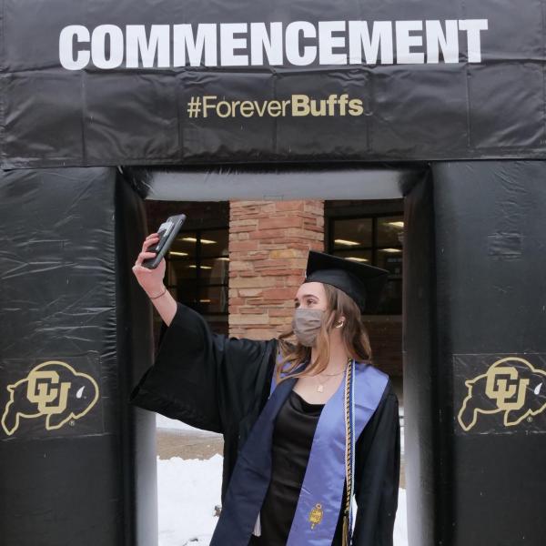 Allie Shea Reuter poses at the 2021 Graduation Appreciation Days photo posing station outside the UMC at CU Boulder. (Photo by Casey A. Cass/University of Colorado)