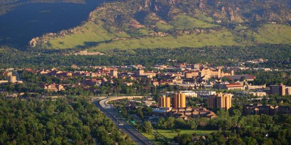 aerial view of the CU Boulder campus, city of Boulder and mountains