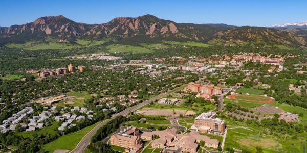CU Boulder aerial campus view with foothills and mountains in the background.