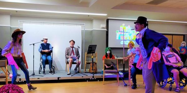 Client actors in a therapy group for aphasia perform in a theatrical production of Charlie and the Chocolate Factory