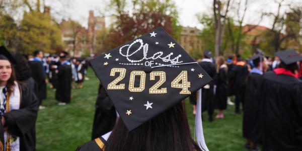 A decorated graduation cap during commencement ceremony