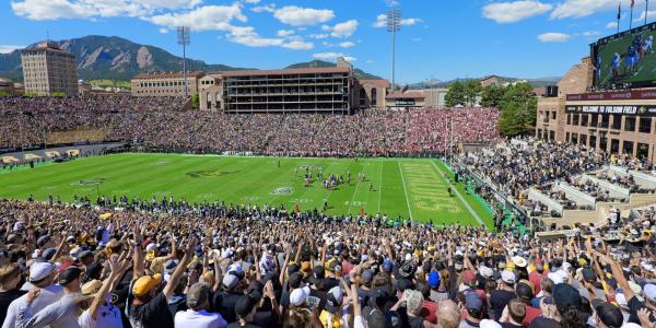 Fans cheering at CU football game at Folsom Field