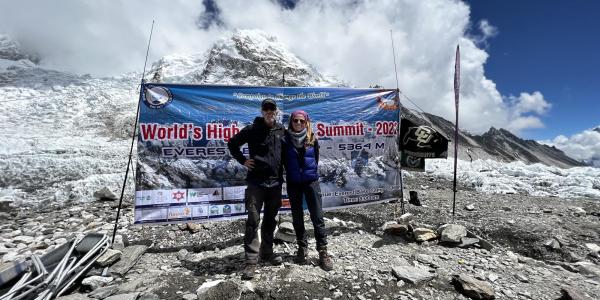 Researchers with CU Boulder and CSU signs at the Everest base camp