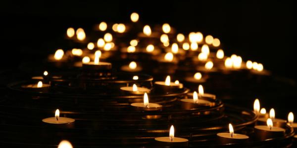 Stock image of lit memorial candles
