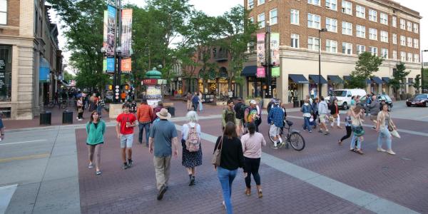 Pedestrians stroll along Pearl Street Mall in Boulder