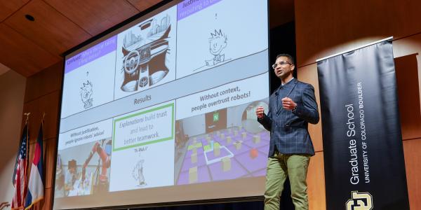 Graduate student competing in the Three Minute Thesis competition