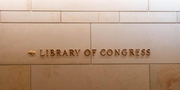 A Library of Congress sign on a stone wall (Photo by sarina gr on Unsplash)