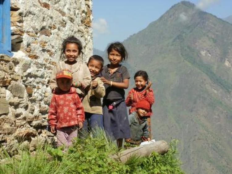 Children standing on a hill