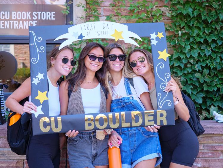 Students pose for a photo in a CU Boulder frame on the first day of classes in 2022