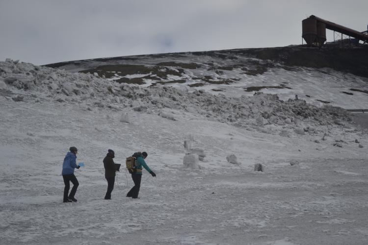 Collecting spectral reflectance measurements of surface snow with corresponding snow samples next to Mine 7 near Longyearbyen, Svalbard.