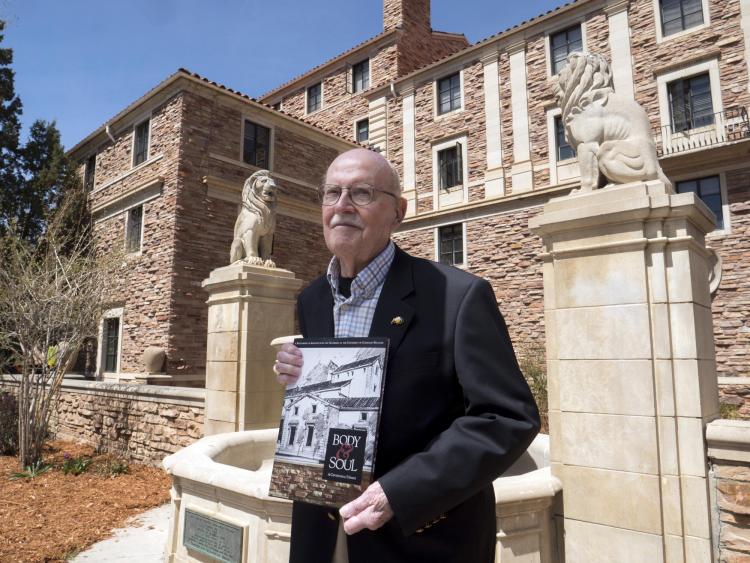 Campus Architect Emeritus Bill Deno poses for photo with new Body & Soul book