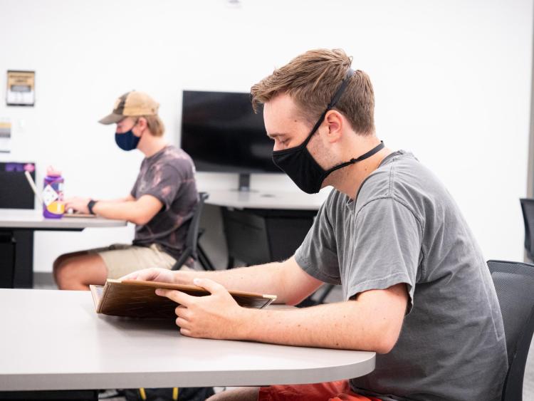 student on campus wearing masks