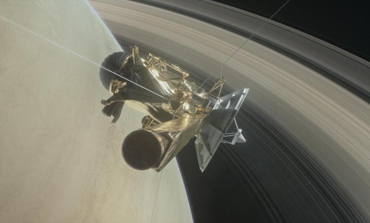 Spacecraft with Saturn and its rings in the background