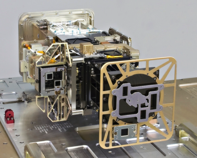 Space instrument sits on a table with the image of a buffalo made from metal on the front