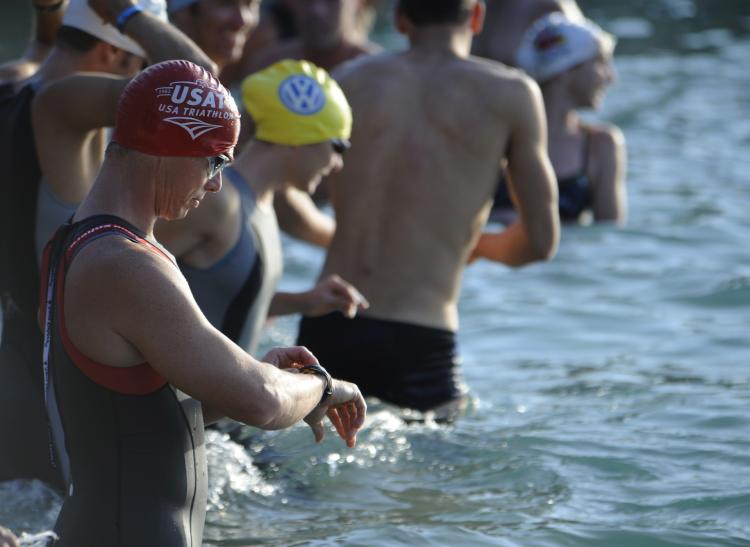 Image of swimmers standing in water.