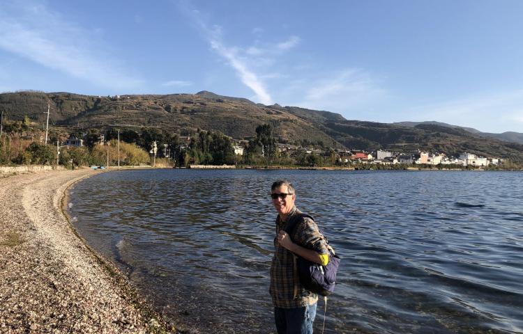 Patrick Kociolek standing on the shoore of a lake