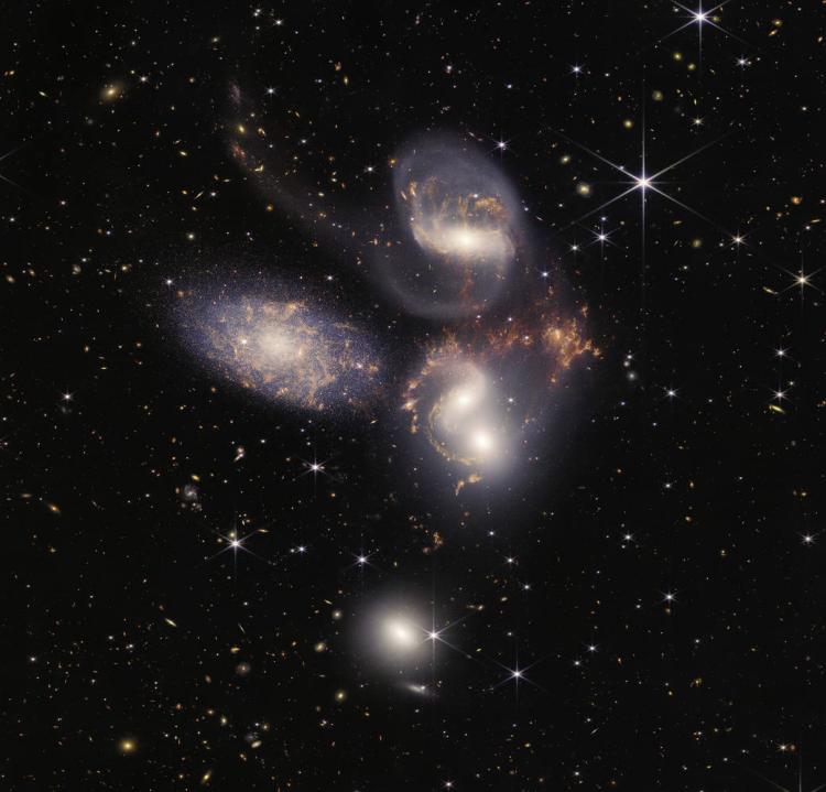 Several galaxies swirl around each other