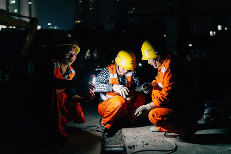 Construction workers at night