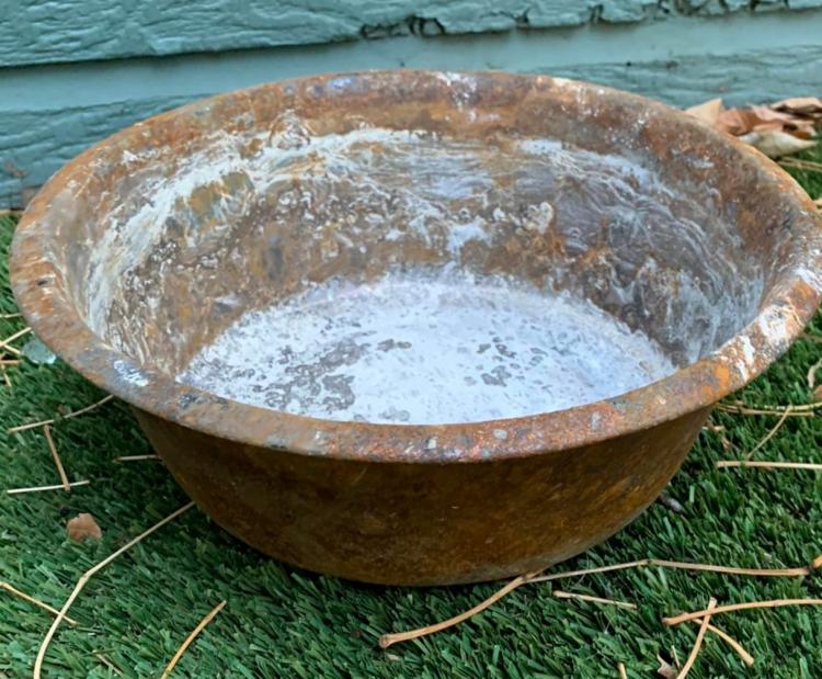 A dog bowl belonging to two labs who perished in the fire