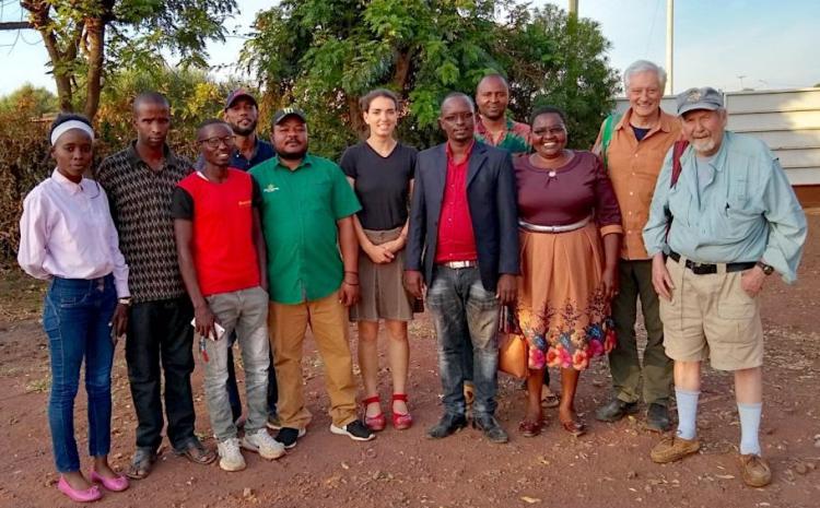 Sarah Posner, John O'Loughlin and Terrence McCabe pose with members of their survey team in Kenya