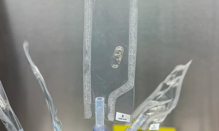 Photo of a clear gelcap pill inside a clear bag