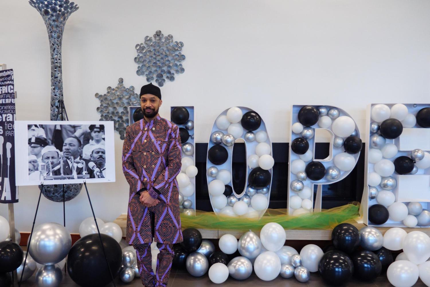 Professor Reiland Rabaka, founder and director of CU Boulder's Center for African and African American Studies, stands in front of a hope display. (Glenn Asakawa/University of Colorado)