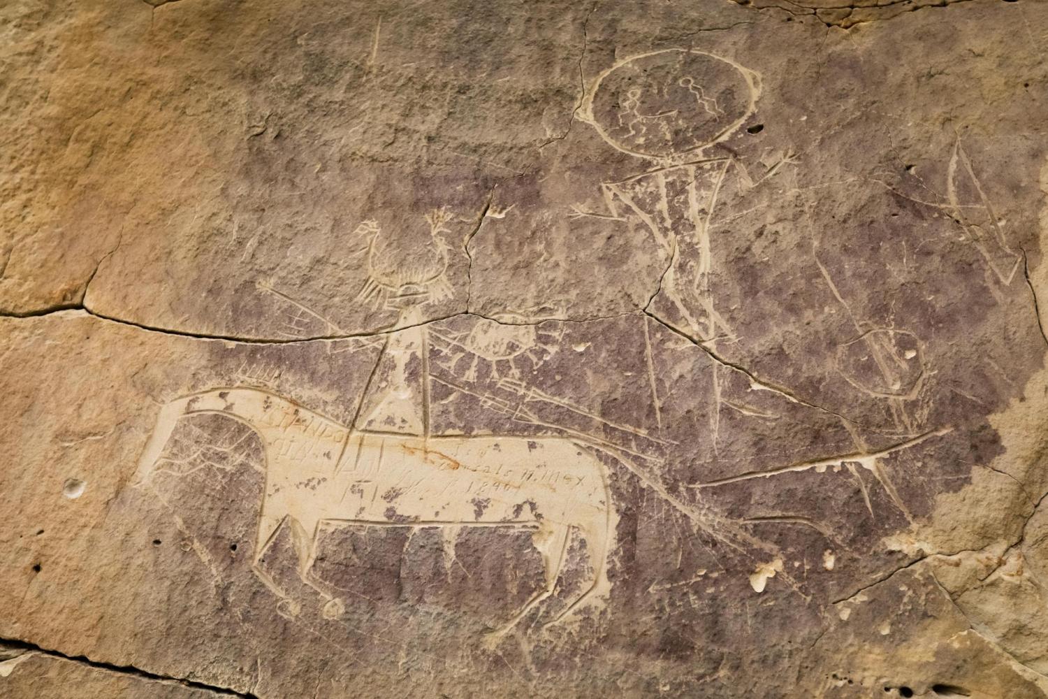 Petroglyphs depicting a rider on a horse