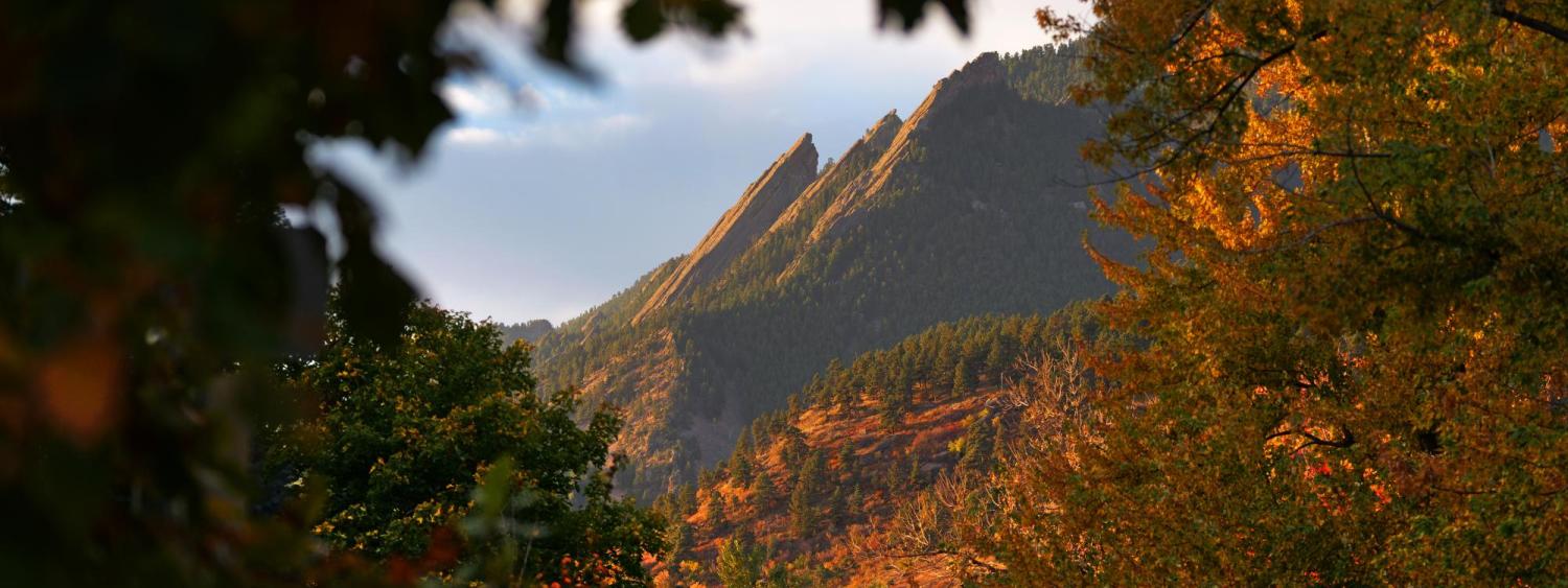 The majestic Flatirons above Boulder framed in fall colors. 