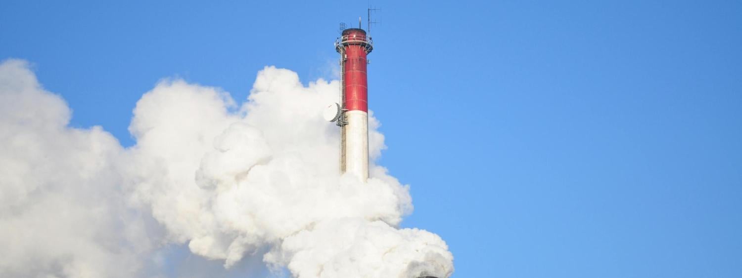 Smoke Stacks Against Blue Sky