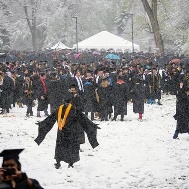 Graduates celebrate during "snow-mencement"