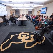 CU Buff rug in focus during a Diversity and Inclusion Summit session