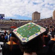 A decorated graduation cap during commencement ceremony