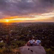 CU Boulder students watch sunset from Flagstaff Mountain