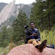 Ani Yahzid with his camera outdoors