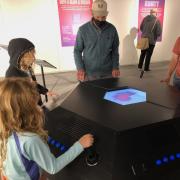 Visitors interact with piece in new exhibit at Museum of Boulder