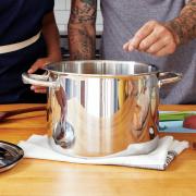 two people cooking in a kitchen