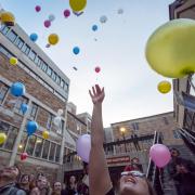 Students release biodegradable balloons as part of class project