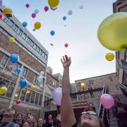 Students release biodegradable balloons as part of class project