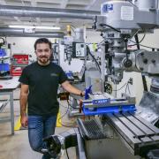Behruzkhon Rashidov, President and founder of the CU Boulder Racing Team, works in the Idea Forge Machine shop.
