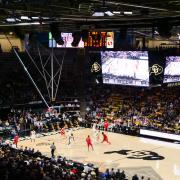 The CU men's basketball team plays an opponent at the CU Events Center.