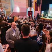 CU Boulder Chancellor Phil DiStefano, left, greets guests and students at the CU Night in Downtown Boulder event at Boulder Theater