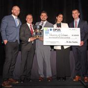 The winning team holds the trophy and prize check at NAIOP's Rocky Mountain Real Estate Challenge