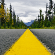 Paved road heading toward the mountains