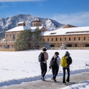 Campus community members walking on a snowy campus