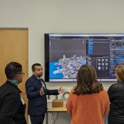 Amir Behzadan demonstrating AI on a monitor