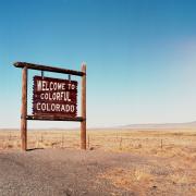 A photo showing a "Welcome to Colorful Colorado" sign (Image by Kait Herzog, via Unsplash)