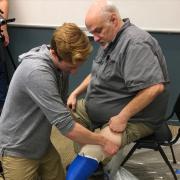 Max Armstrong performs prosthetic socket fitting