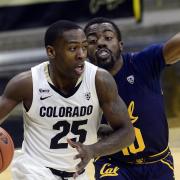 Colorado's McKinley Wright IV, left, drives past a Cal player during a Pac-12 Conference basketball game