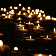 Stock image of lit memorial candles
